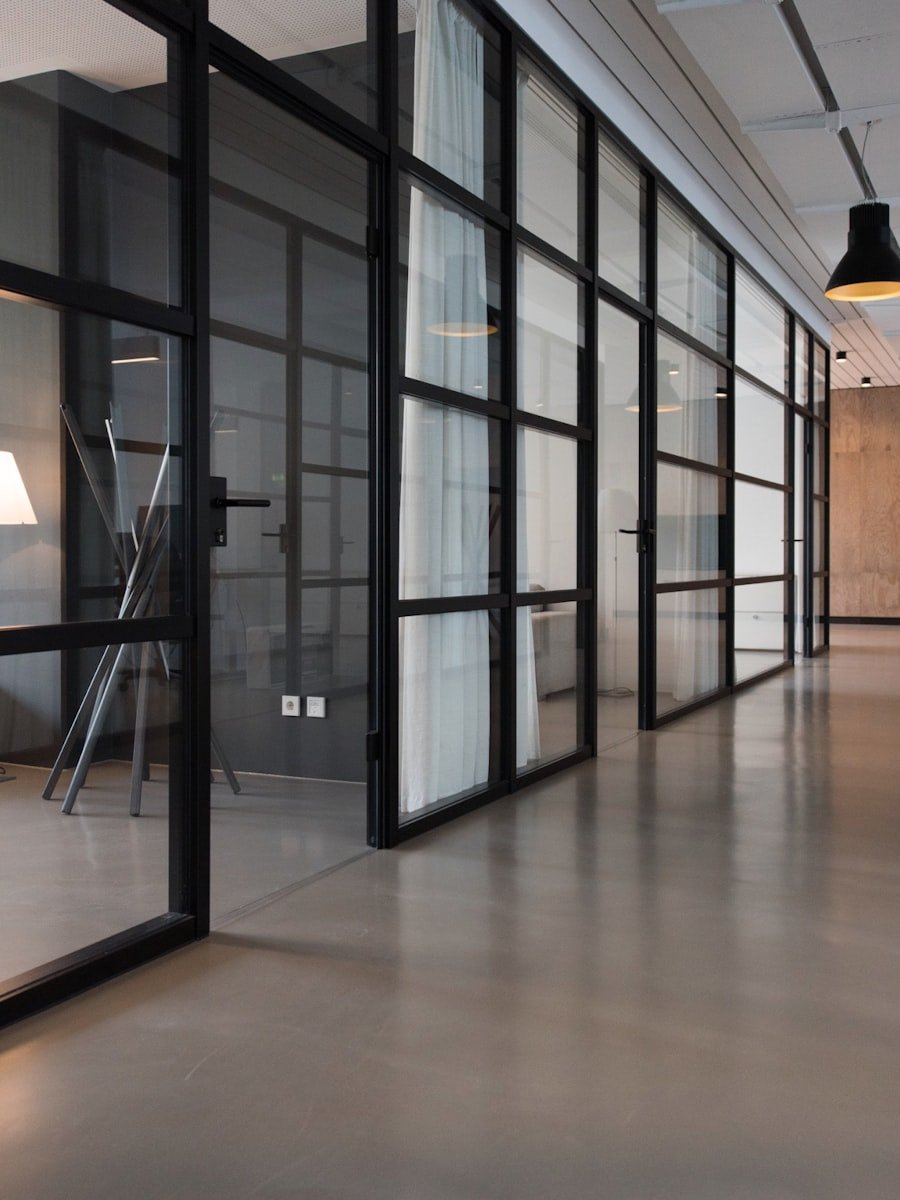 A modern studio interior with glass-walled rooms.